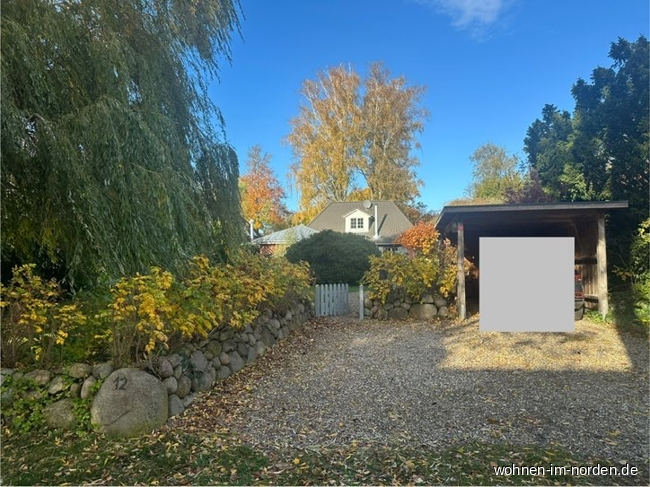 Straenansicht mit Carport und Stellplatz Einfamilienhaus Hohwacht